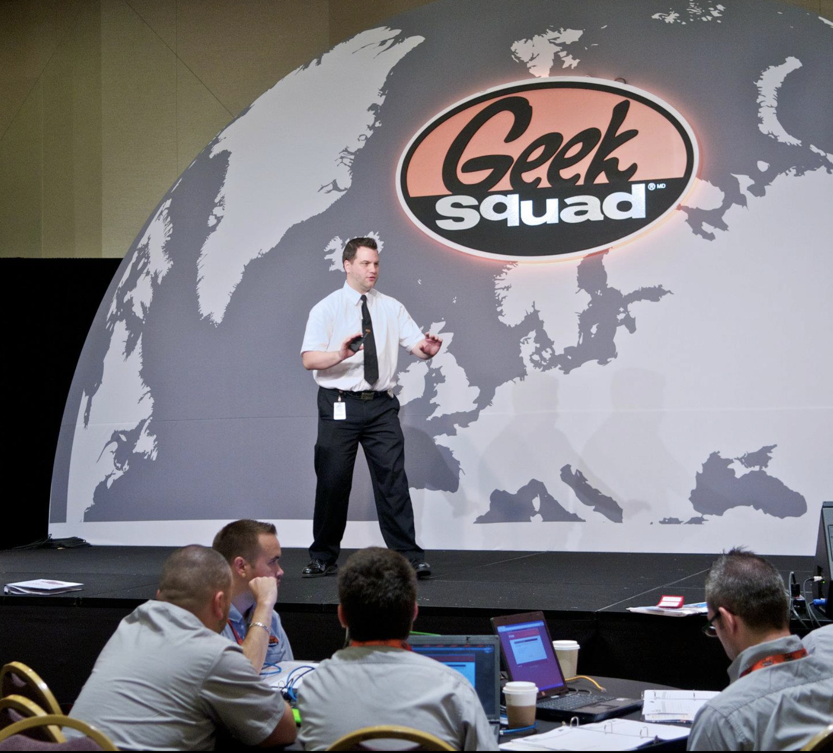 Sean speaking on a Geek Squad stage